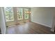 Dining room with hardwood floors and a picturesque view from large windows at 691 Bandon Aly, Cary, NC 27513