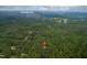 Aerial shot of a lush, wooded property near the University of North Carolina at 708 October Woods Rd, Chapel Hill, NC 27516