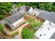 Birds eye view of sprawling property with stone and gravel paths through the green spaces at 708 October Woods Rd, Chapel Hill, NC 27516
