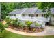 Beautiful backyard showcasing a large deck and lush landscaping at 708 October Woods Rd, Chapel Hill, NC 27516