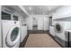 Spacious basement area with two sets of laundry and storage with cabinets at 708 October Woods Rd, Chapel Hill, NC 27516