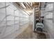 Unfinished basement area with shelving and HVAC system for storage options at 708 October Woods Rd, Chapel Hill, NC 27516
