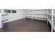 Unfinished basement offers ample storage space with installed shelving at 708 October Woods Rd, Chapel Hill, NC 27516