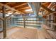 Unfinished basement featuring exposed beams and ductwork with shelving along back wall at 708 October Woods Rd, Chapel Hill, NC 27516