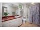 Bathroom featuring a large vanity with drawers and a shower with neutral-patterned curtain at 708 October Woods Rd, Chapel Hill, NC 27516