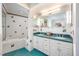 Bathroom featuring double vanity, tub/shower combo and colorful accent tiles at 708 October Woods Rd, Chapel Hill, NC 27516