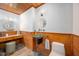 Charming half-bath features a unique sink and wooden paneling at 708 October Woods Rd, Chapel Hill, NC 27516