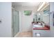 Bathroom featuring a walk-in shower and sleek vanity, offering a serene and functional space at 708 October Woods Rd, Chapel Hill, NC 27516