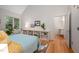 Bright bedroom with hardwood floors, vaulted ceiling and a window overlooking greenery at 708 October Woods Rd, Chapel Hill, NC 27516