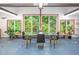 Bright dining room with floor to ceiling windows overlooking nature at 708 October Woods Rd, Chapel Hill, NC 27516