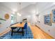 Elegant dining area with wood table, blue chairs, and bright natural light at 708 October Woods Rd, Chapel Hill, NC 27516