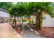 Exterior view featuring a unique trellis and winding walkways at 708 October Woods Rd, Chapel Hill, NC 27516
