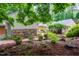 Exterior shows yard featuring winding stone pathway and mature landscaping at 708 October Woods Rd, Chapel Hill, NC 27516