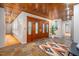 Inviting foyer with warm wood ceiling, tiled floor, and decorative front door at 708 October Woods Rd, Chapel Hill, NC 27516