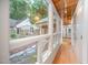 Inviting hallway with hardwood floors and views of the landscaped front yard through bright, large windows at 708 October Woods Rd, Chapel Hill, NC 27516