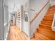 Hallway features wooden stairs, wood floors and built-in shelving at 708 October Woods Rd, Chapel Hill, NC 27516