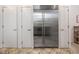 Stainless steel refrigerator with white doors on either side, set against tiled floor at 708 October Woods Rd, Chapel Hill, NC 27516