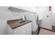 Laundry area with a sink, countertop, and cabinets for convenient storage at 708 October Woods Rd, Chapel Hill, NC 27516