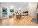 Bright living room with hardwood floors, high ceilings, and cozy seating area at 708 October Woods Rd, Chapel Hill, NC 27516