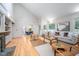 Open living room with hardwood floors, high ceilings, and comfortable seating at 708 October Woods Rd, Chapel Hill, NC 27516