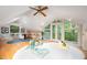 Living space features vaulted ceilings, wood floors, windows and doors to the outside at 708 October Woods Rd, Chapel Hill, NC 27516