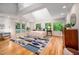Spacious main bedroom with vaulted ceilings, ample windows, and access to an outdoor balcony at 708 October Woods Rd, Chapel Hill, NC 27516
