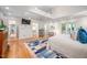 Bright bedroom features high ceilings, light hardwood floors, access to closets and outdoor deck at 708 October Woods Rd, Chapel Hill, NC 27516