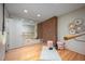 Bright studio features brick accent wall, mirrored wall, hardwood floors, and natural light at 708 October Woods Rd, Chapel Hill, NC 27516