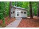 Exterior view of a studio featuring a door and multiple windows with a path leading to it at 708 October Woods Rd, Chapel Hill, NC 27516