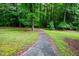 Path through lush green yard with trees at 708 October Woods Rd, Chapel Hill, NC 27516