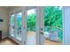 Balcony with a table and chairs with exterior greenery view at 729 Lorentello Cir, Hillsborough, NC 27278