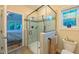 Clean and bright bathroom featuring a glass-enclosed shower and modern fixtures at 729 Lorentello Cir, Hillsborough, NC 27278
