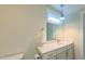Bathroom featuring a vanity with solid surface counter and neutral finishes at 729 Lorentello Cir, Hillsborough, NC 27278