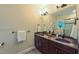 Elegant bathroom with double vanity, granite countertops and modern lighting fixtures at 729 Lorentello Cir, Hillsborough, NC 27278