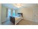 Bedroom featuring carpet, a ceiling fan, and natural light from windows at 729 Lorentello Cir, Hillsborough, NC 27278
