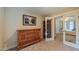 View of a bedroom, with a wooden dresser, an open closet, and a doorway that gives access to the Primary bedroom at 729 Lorentello Cir, Hillsborough, NC 27278