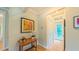 Foyer with hardwood floors, artwork, and a view of the entryway and hallway at 729 Lorentello Cir, Hillsborough, NC 27278