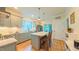Charming kitchen with modern appliances, kitchen island, wooden chairs, and hardwood flooring at 729 Lorentello Cir, Hillsborough, NC 27278