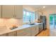 Modern kitchen with stainless steel appliances, ample counter space, and abundant natural light at 729 Lorentello Cir, Hillsborough, NC 27278