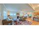 Bright living room featuring hardwood floors, fireplace, ceiling fan and an open floor plan at 729 Lorentello Cir, Hillsborough, NC 27278