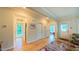 Spacious living room featuring hardwood floors and multiple entryways at 729 Lorentello Cir, Hillsborough, NC 27278