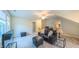 Living room features plush seating, wet bar, and natural light at 729 Lorentello Cir, Hillsborough, NC 27278