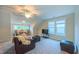 Living room featuring plush seating, natural light, and ceiling fan at 729 Lorentello Cir, Hillsborough, NC 27278