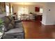 Open dining area with hardwood floors, modern chandelier, and a view into the kitchen at 740 Obsidian Way, Durham, NC 27703