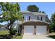 Charming two-story home with a well-maintained lawn, a two-car garage and brick accents at 740 Obsidian Way, Durham, NC 27703