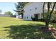 Charming home situated on green lawn featuring siding, well-maintained yard, and mature tree in a residential setting at 740 Obsidian Way, Durham, NC 27703