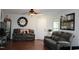 Cozy living room featuring hardwood floors, comfortable seating and ample natural light at 740 Obsidian Way, Durham, NC 27703