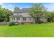 Large grassy backyard with patio and swing at 75 Mountainside Ln, Sanford, NC 27332