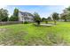 Spacious backyard features a grill, patio, and lush green grass at 75 Mountainside Ln, Sanford, NC 27332
