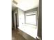 Bright bathroom featuring a garden tub and large window at 75 Mountainside Ln, Sanford, NC 27332